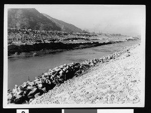 View of a water-flow channel with rocky banks