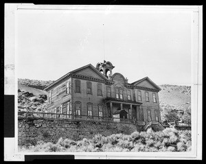 Exterior view of a school house on a hill in Gold Hill, Nevada, ca.1900