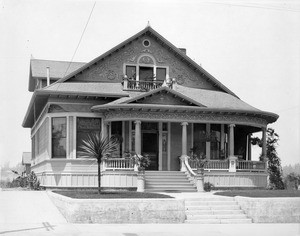 Exterior view of a two-story house on North Flower Street in Los Angeles