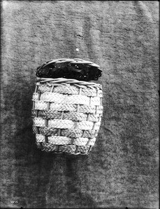 Unidentified Indian basket on display, ca.1900