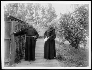 Father Victor and a Franciscan in the garden at St. Josephs Church, Los Angeles, 1899