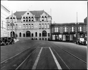 Exterior view of the Los Angeles Central Jail, showing parked automobiles, ca.1925-1930