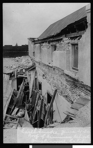 Earthquake damage in Inglewood, showing damage to roof of grammar school, June 1920