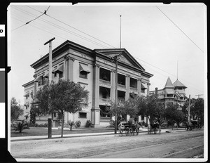 Pacific Hospital, with carriages on the street