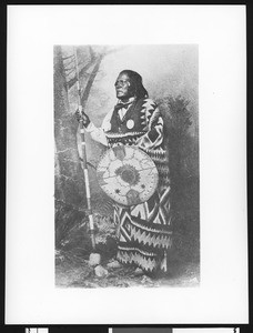 Portrait of an Apache man with a shield and staff, ca.1880