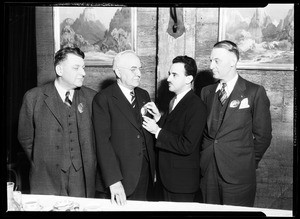 Mexican Consul Hon. Rafael de la Colina presenting Mexican police badges to three men, December 3, 1931