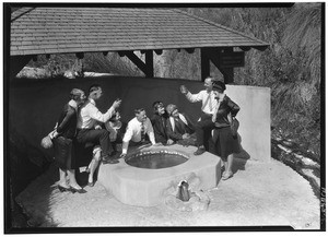 People drinking out of a well at Penyguar Springs in Arrowhead Springs, October 3, 1926