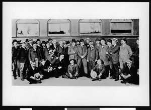 Members of the Sunset Club standing in front of a railroad car, ca.1903