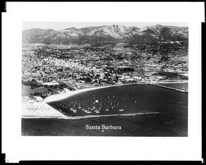 Aerial view of Santa Barbara and the harbor from the ocean, ca.1935