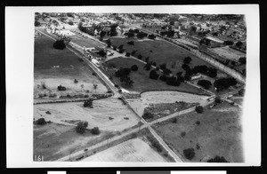 Aerial view of flooding on a railroad bridge in Big Santa Anita Canyon in Monrovia, 1938