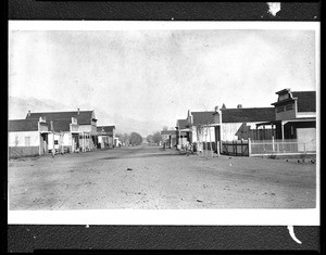 Empty street in Independence showing the Levi Hotel after the fire, ca.1887-1888