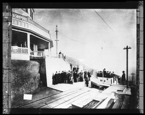 Passengers exiting a railway car at the newly-opened Echo Mountain House on Mount Lowe, 1894