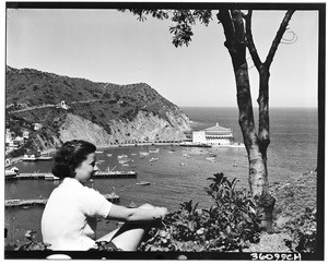 Woman looking towards Avalon Harbor and Casino from a nearby hill