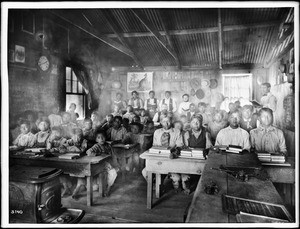 Classroom of students with their teachers inside a Walapai Indian school at Hackbury, Arizona, circa 1900