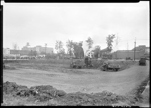 Steam shovel excavating a construction site