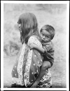 Havasupai mother, Pana-na-hita, carrying her baby on her back, ca.1900