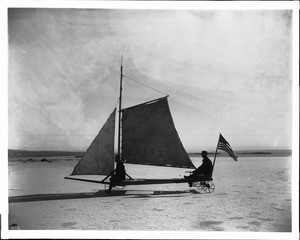 Vehicle "Desert Queen" sailing on a dry lake at Rosamond in the Mojave Desert, 1904