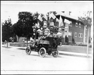 Members of W. Herbert Allen's family in a highly decorated Tourist automobile, ca.1910