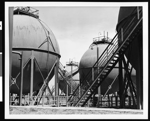 Exterior view of the Shell Oil Company, showing spherical tanks, ca.1940