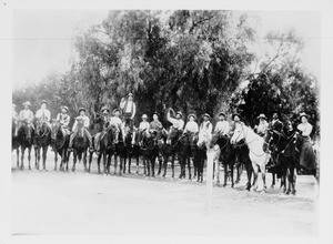 Mexican American cowboys lined up at a fiesta and pasear held by the old Californian families of the San Juan-San Luis Rey region, ca.1900