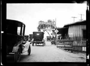 Cars lined up outside a Customs House at San Ysidro, south of San Diego