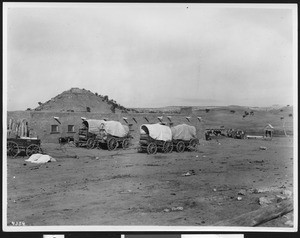 Five Navajo Indian wagons outside Hubbell's Indian Agency Store, Ganado, Arizona, ca.1870-1905