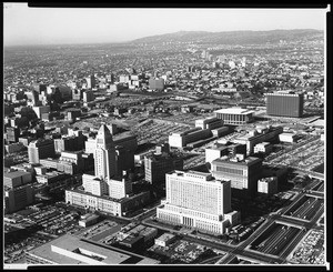 Birdseye view of downtown Los Angeles, looking west toward Wilshire Boulevard and Beverly Hills, showing City Hall