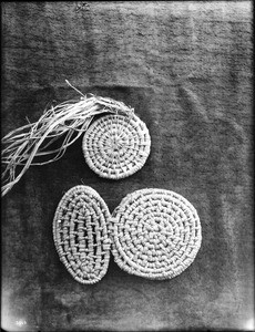 Two unidentified Indian baskets on display, ca.1900