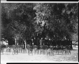 Members of the Sunset Club at a meeting under a large oak tree, ca.1910