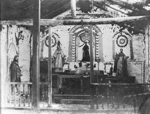 Altar of Mission Asistencia of San Antonio at Pala, showing wooden statue made by the Indians, ca.1898