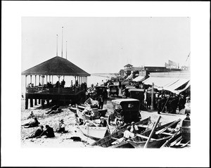 Fishing boats and early automobiles along the pier at Newport Beach, ca.1910