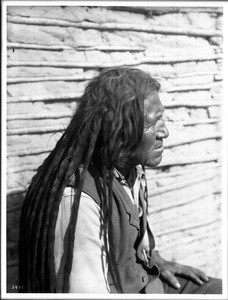 Yuma Indian man wearing a vest, looking right, ca.1900