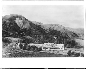 Arrowhead Hotel from a distance, with the famous Indian Arrohead on the mountains behind, San Bernardino, ca.1908