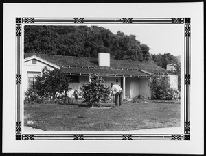 Unidentified ranch house in Los Angeles with a man in the front yard