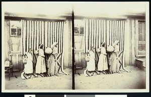 Three Walapai Indian children with pots on their backs