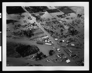 Aerial view of flood damage to a housing area in Stanton or Buena Park, 1938