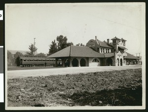 Exterior view of the Salt Lake Railroad Depot in Riverside, showing a train, ca.1910