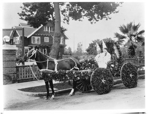 Horse-drawn float in the Pasadena Tournament of Roses Parade, ca.1900