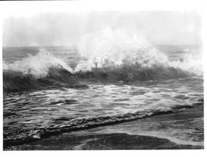 View of the Pacific Ocean (painting?), showing a waves breaking near the beach, ca.1900-1950