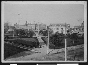 Park scene in Watsonville, showing what appears to be a central square, ca.1900