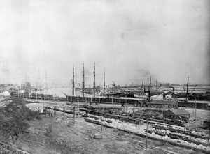 View of the Los Angeles Harbor, showing a railroad yard and docked ships