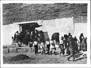 Procession leaving the church during the Fiesta de San Esteban (Saint Stephen), Acoma Pueblo, 1886