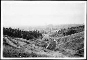 Panoramic view of the completed lanes of North Figueroa Street, looking south from Spruce Street, showing automobiles, February 1936