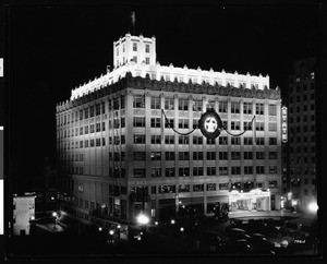 Exterior view of the Jergins Trust and State Theatre building at night in Long Beach, 1931