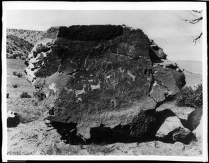 View of Comanche Indian Rock with Native American art, on the Crosselle Ranch in Folsome, New Mexico, ca.1900