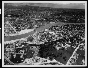 Aerial view of flooded Los Angeles River at Fletcher Drive bridge, 1938