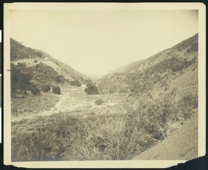 Desert view showing mining equipment, ca.1907