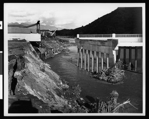 Flood-damaged bridge with Warner Brothers Studios (?) at left, 1938