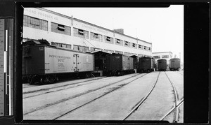 Loading platform for railroad cars in the Central Manufacturing District, showing cars with "Pacific Fruit Express", July 1, 1932