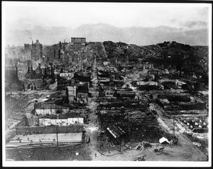 View of the aftermath of the 1906 San Francisco earthquake and fires, showing a view of Ferry Building tower looking toward Nobb Hill, 1906